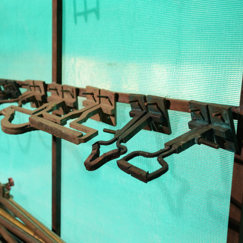 Component fixtures racked on the shop floor