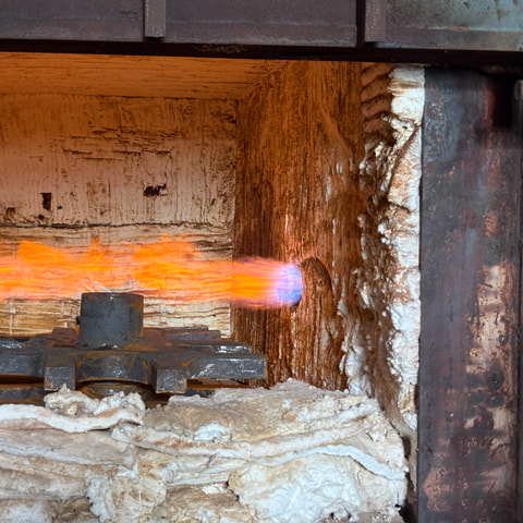 A component at temperature inside a refractory-lined furnace
