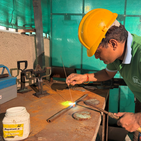 Torch brazing a coil assembly in the inductor workshop
